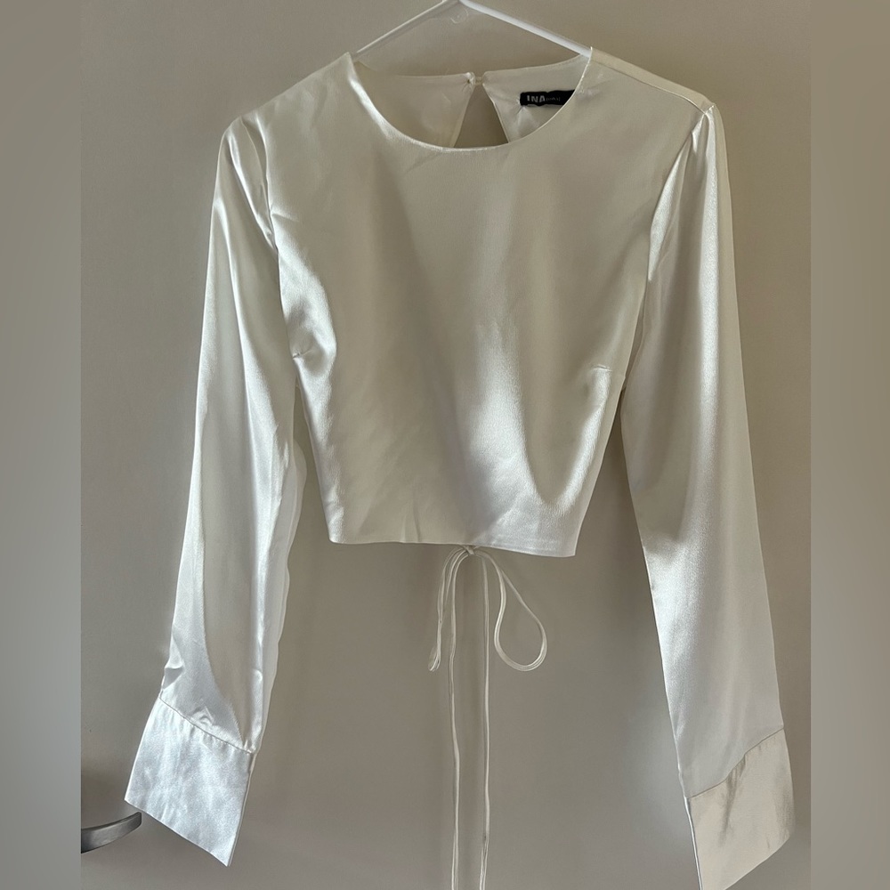 Long sleeve white satin crop top with open back